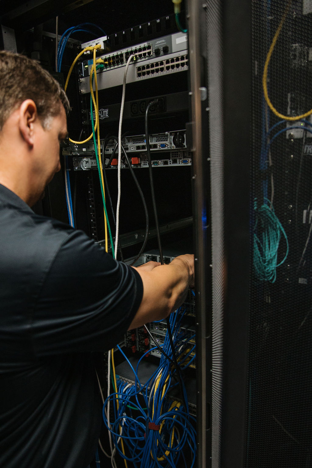 Technician working in a server rack